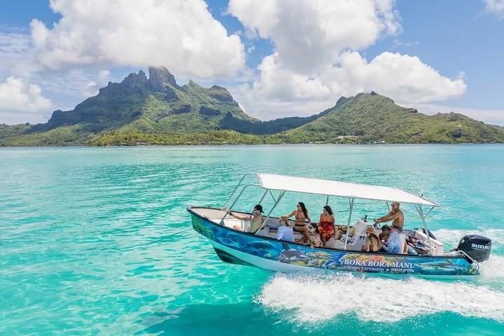 Guests on the boat with Mount Otemanu behind
